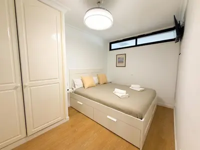 Cama o camas de una habitación en Beachfront Las Canteras 78
