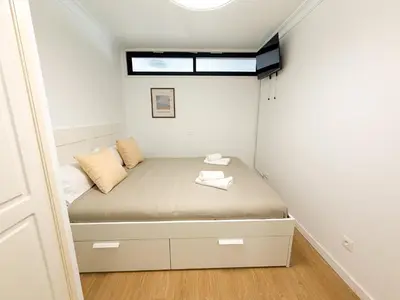 Cama o camas de una habitación en Beachfront Las Canteras 78