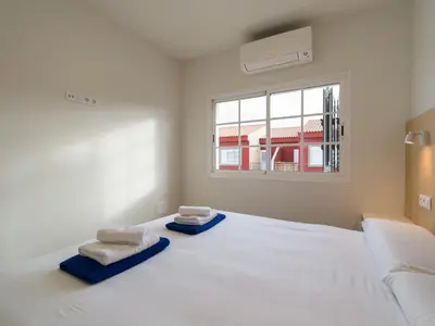 Cama o camas de una habitación en Las Velas Suites Meloneras