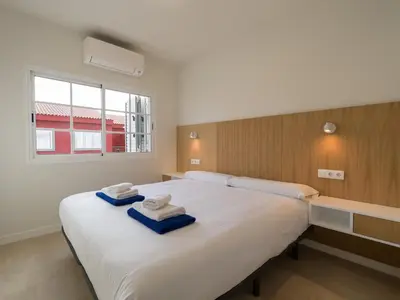 Cama o camas de una habitación en Las Velas Suites Meloneras