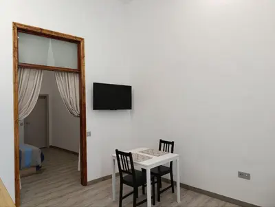 Una televisión o centro de entretenimiento en Casa San Gregorio