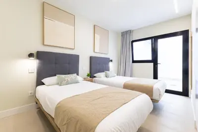 Cama o camas de una habitación en Brisamar Suites I by VillaGranCanaria