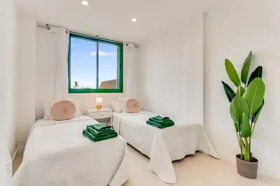 Cama o camas de una habitación en Sunny Garden Monte Paraiso