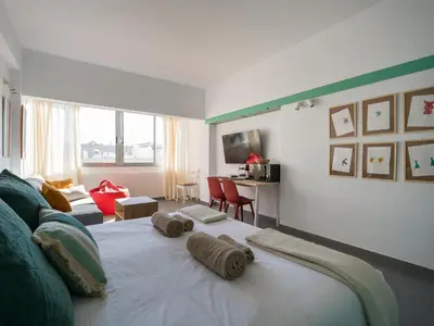 Una televisión o centro de entretenimiento en Apartamento Playa 57