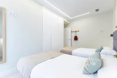 Cama o camas de una habitación en Brisamar Suites by VillaGranCanaria