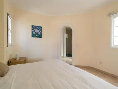 Cama o camas de una habitación en La Gloria Villas San Agustin