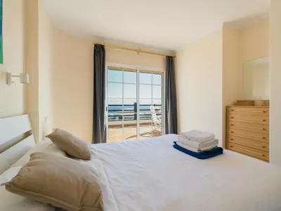 Cama o camas de una habitación en La Gloria Villas San Agustin