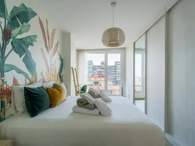 Cama o camas de una habitación en 3BR Ocean Sunset Suite Las Canteras