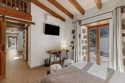 Cama o camas de una habitación en La Pelusa casa rural