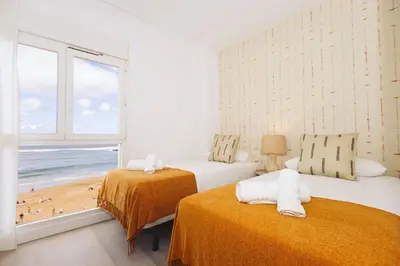 Cama o camas de una habitación en Beachfront apartment in Las Canteras S4
