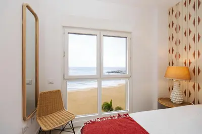 Cama o camas de una habitación en Beachfront apartment in Las Canteras S5