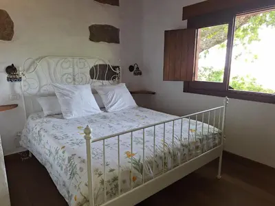 Cama o camas de una habitación en CASA RURAL CON PISCINA PRIVADA El ROBLE