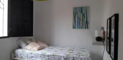 Cama o camas de una habitación en Faro de sardina Apartment