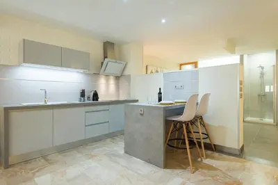 Una cocina o zona de cocina en Suites Garden Loft El Greco