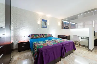 Cama o camas de una habitación en Suites Garden Loft Dalí