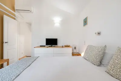 Una televisión o centro de entretenimiento en Home2Book Relaxing Stay & Terrace in Maspalomas