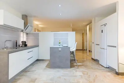 Una cocina o zona de cocina en Suites Garden Loft Picasso