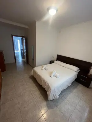 Cama o camas de una habitación en Apartamentos Las Canteras Arena