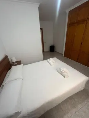 Cama o camas de una habitación en Apartamentos Las Canteras Arena