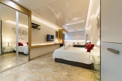 Cama o camas de una habitación en Suites Garden Loft Munch