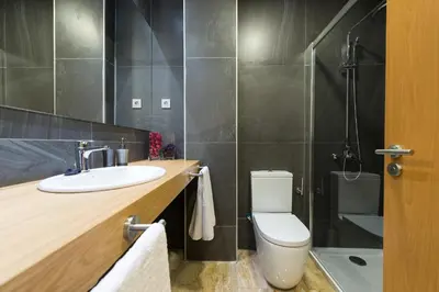 Un baño de Suites Garden Loft Munch