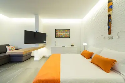 Cama o camas de una habitación en Suites Garden Loft Miro