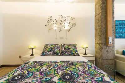 Cama o camas de una habitación en Suites Garden Loft Roy Lichtenstein