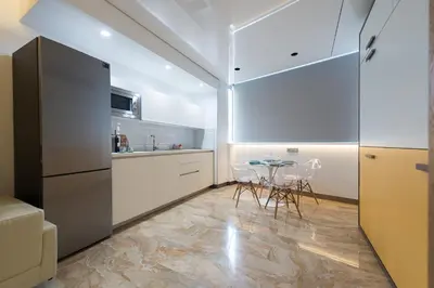 Una cocina o zona de cocina en Suites Garden Loft Roy Lichtenstein