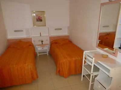 Cama o camas de una habitación en Apartamentos Belmonte