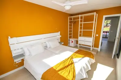 Cama o camas de una habitación en New Miami Playa Apartamentos