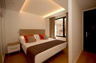 Cama o camas de una habitación en Apartamentos Natural Park