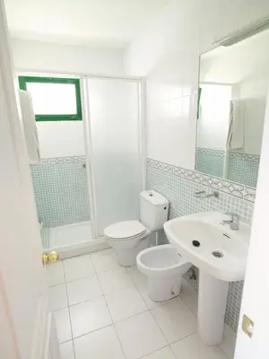 Un baño de Apartamentos Babalu