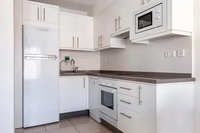 Una cocina o zona de cocina en Club Cala Blanca