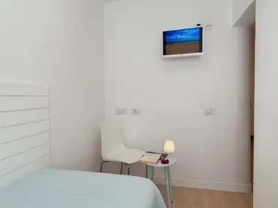 Una televisión o centro de entretenimiento en Bungalow Playa del Inglés JFGI by VillaGranCanaria