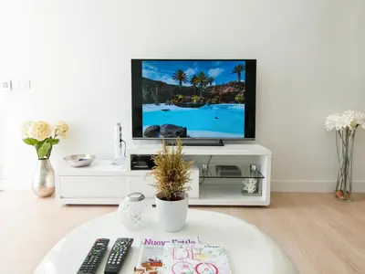 Una televisión o centro de entretenimiento en Bungalow Playa del Inglés JFGI by VillaGranCanaria
