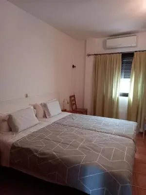Cama o camas de una habitación en Apartamentos el Motor Tejeda