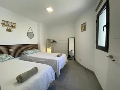 Cama o camas de una habitación en Holiday Home & Rooftop Lounge