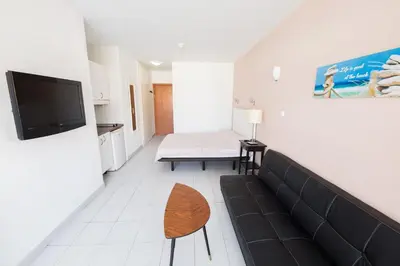 Una televisión o centro de entretenimiento en Apartamento Tobago