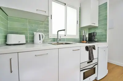 Una cocina o zona de cocina en Palm Suites