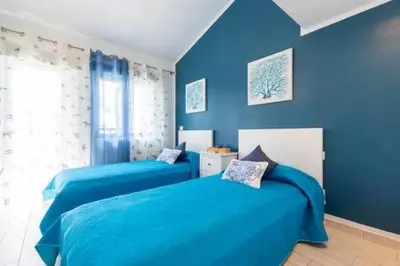 Cama o camas de una habitación en Lidia & Paco Home two bedrooms beachfront