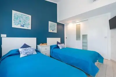Cama o camas de una habitación en Lidia & Paco Home two bedrooms beachfront