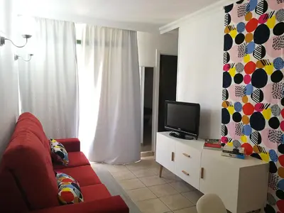Una televisión o centro de entretenimiento en HUELLA CANARIA Complejo LAS OLAS