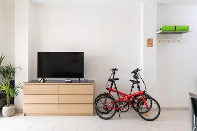 Una televisión o centro de entretenimiento en Living Las Canteras Homes - WORKOUT & FREE BIKES