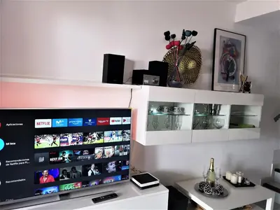 Una televisión o centro de entretenimiento en Maspalomas Bungalow C I