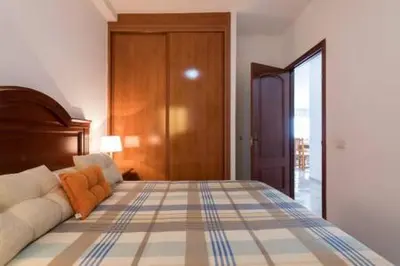 Cama o camas de una habitación en Apartamentos Castillo Mar Gran Canaria