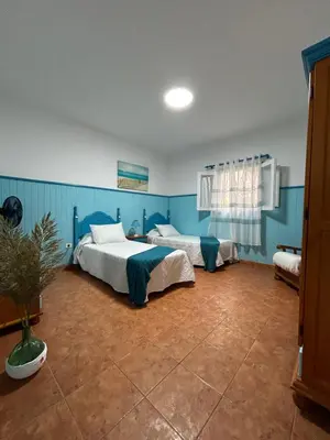 Cama o camas de una habitación en Apartamentos Buen Leon