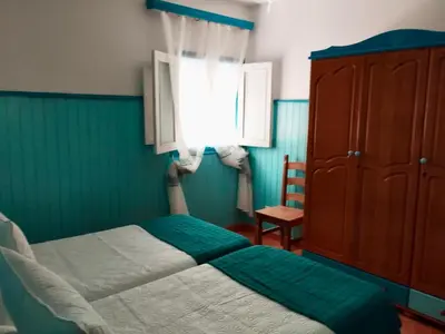 Cama o camas de una habitación en Apartamentos Buen Leon
