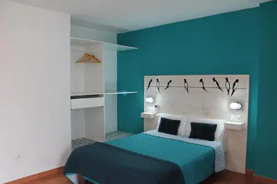 Cama o camas de una habitación en Hotel el Pino