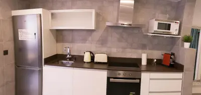 Una cocina o zona de cocina en Piso con piscina y garaje en la Playa de Las Canteras