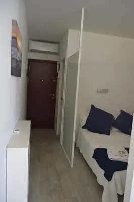 Cama o camas de una habitación en Vivienda Vacacional AP Las Canteras